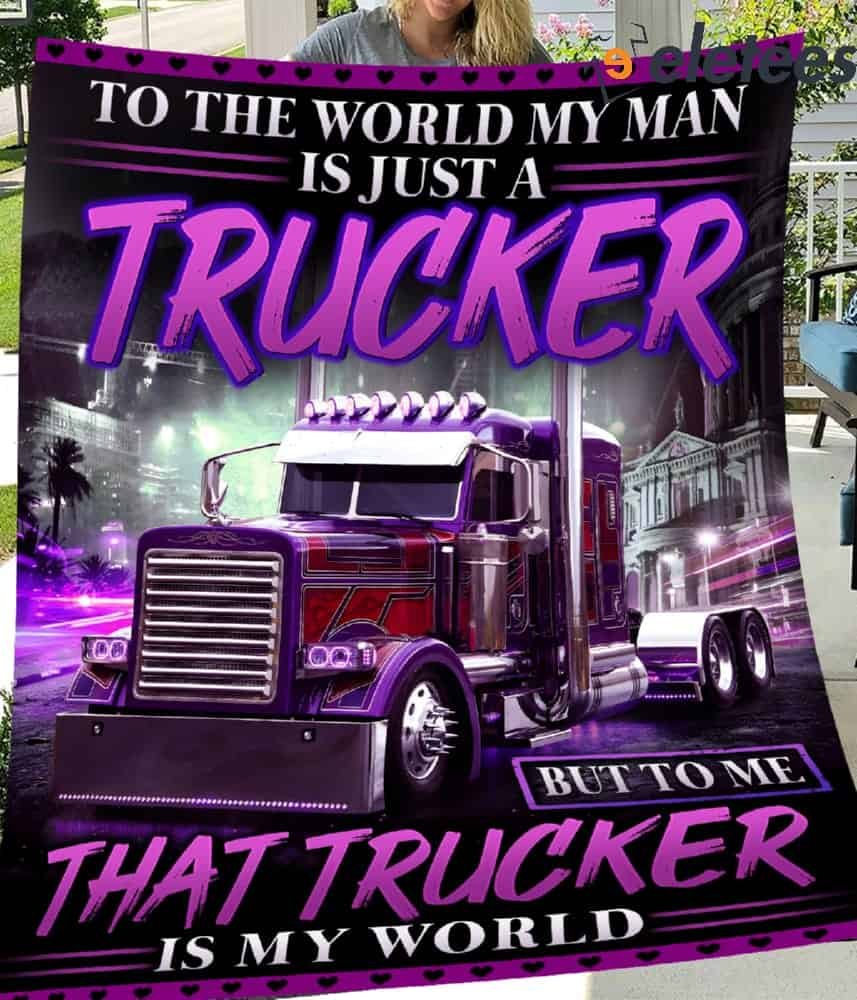 https://eletees.com/wp-content/uploads/2023/10/To-The-World-My-Man-Is-just-A-Trucker-But-To-Me-That-Trucker-Is-My-World-Blanket-1.jpg