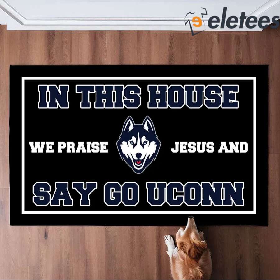 In This House We Praise Jesus And Say Go Uconn Doormat