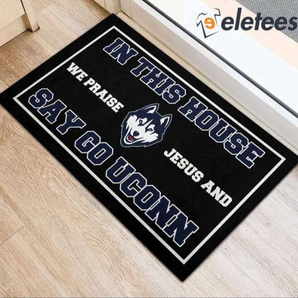 In This House We Praise Jesus And Say Go Uconn Doormat
