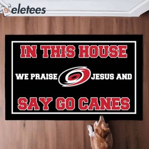 In This House We Praise Jesus and Say Go Canes Doormat