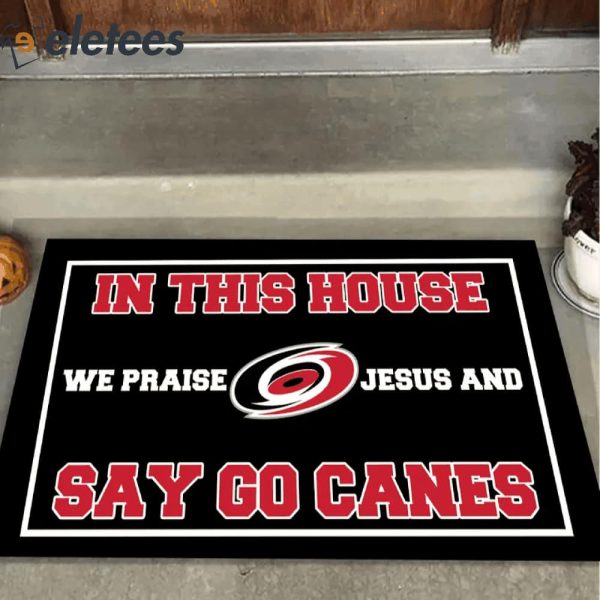 In This House We Praise Jesus and Say Go Canes Doormat