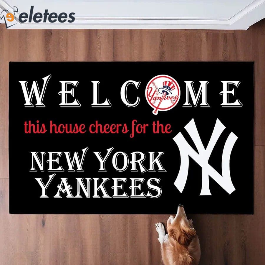 https://eletees.com/wp-content/uploads/2023/12/Welcome-This-House-Cheers-For-The-NY-Yankees-Doormat.jpg